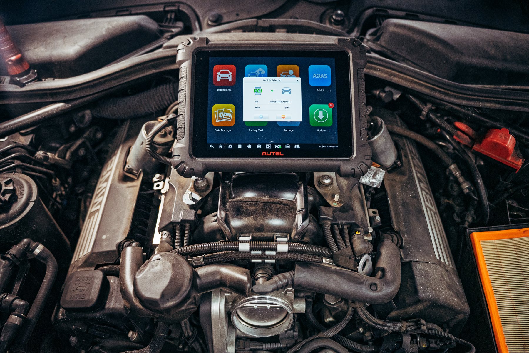 Scan tool connected in an engine bay