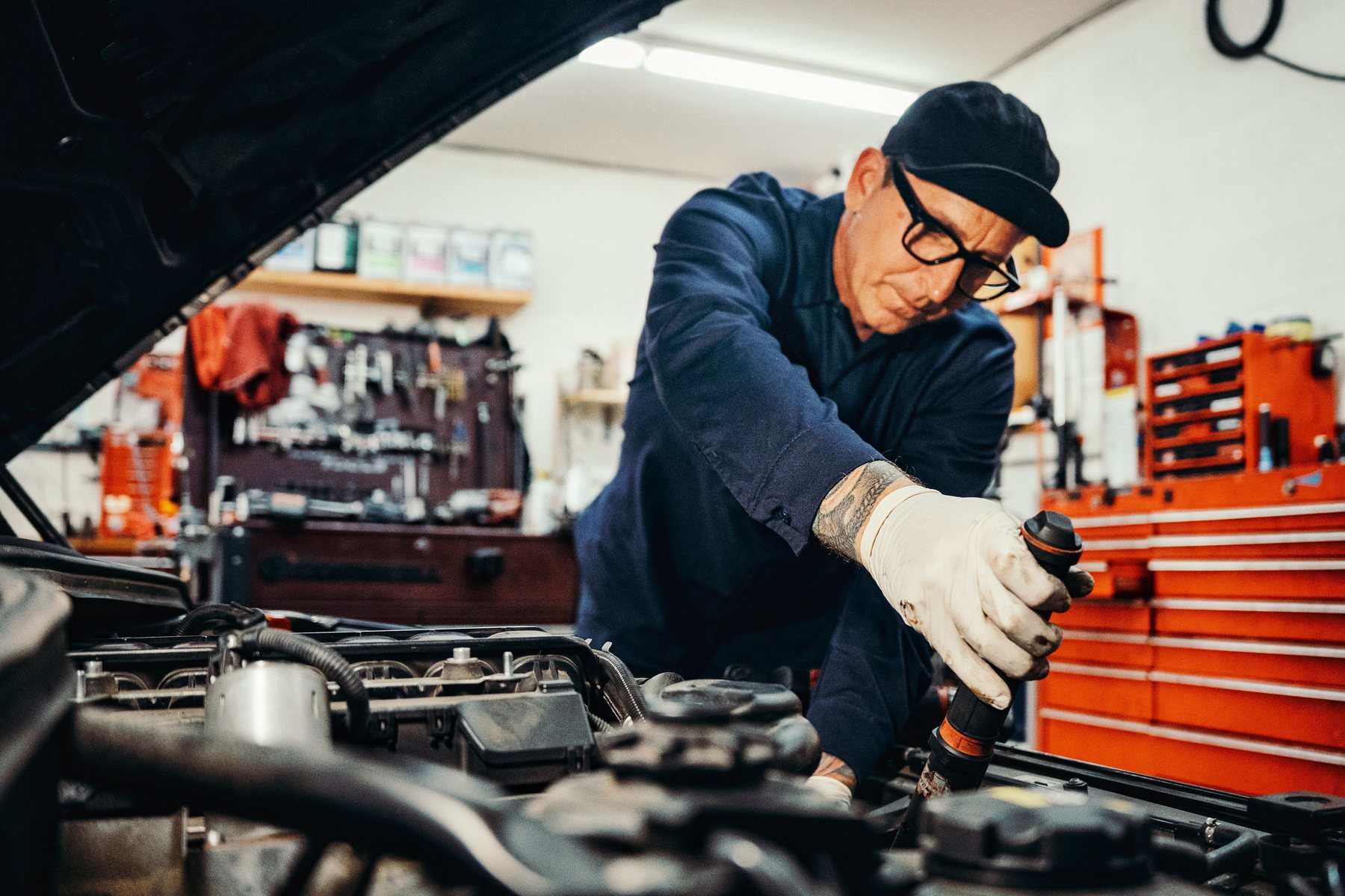 Technician working in an engine bay at Chariot Automotive